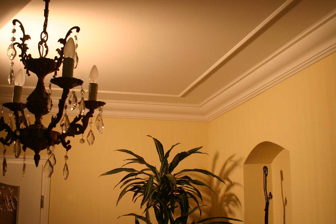 130-dct-plain-styrofoam-crown-molding-6-inch-installed-image.jpg ceiling with a classic chandelier, crown molding and a trim.