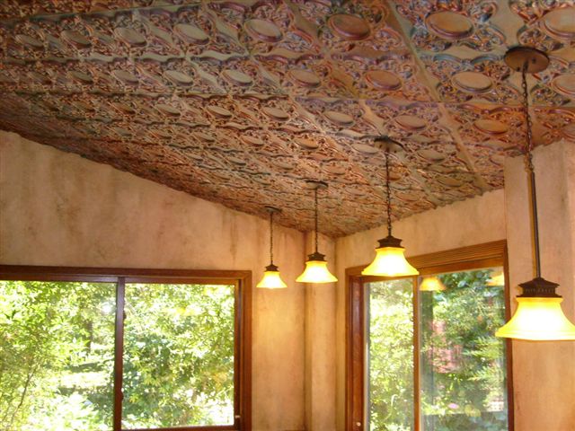 133-hand-painted-installed-large.jpg Cathedral ceiling with 3 lights and faux finished ceiling tiles.