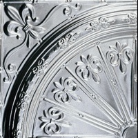 A quarter of a tin ceiling medallion with Fleur de Lis deisgn.