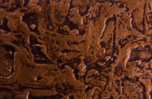 Larger hammered pattern wc40 faux tin backsplash in antique copper. Image taken of 6x4 swatch.