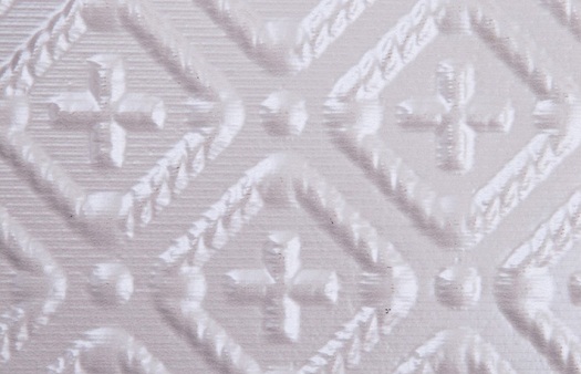 WC 70 Faux Tin Backsplash Roll in white pearl.  The image is taken of an 6x4 piece of the actual product.