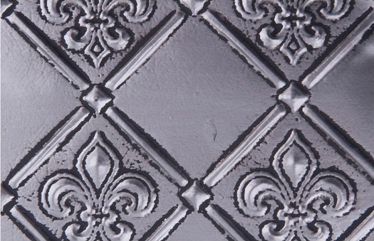 WC 80 Faux Tin Backsplash - Antique Copper has a nice fleur the lis 3d design.  The image is takeon of a 6x4 inch piece of this product. 